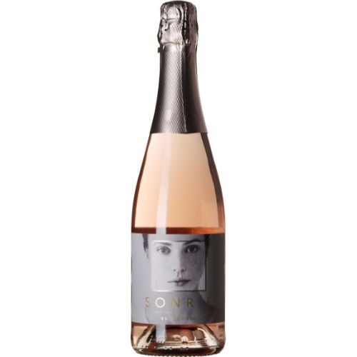 Bottle of Sonrie sparkling wine with a label featuring a face on a white background